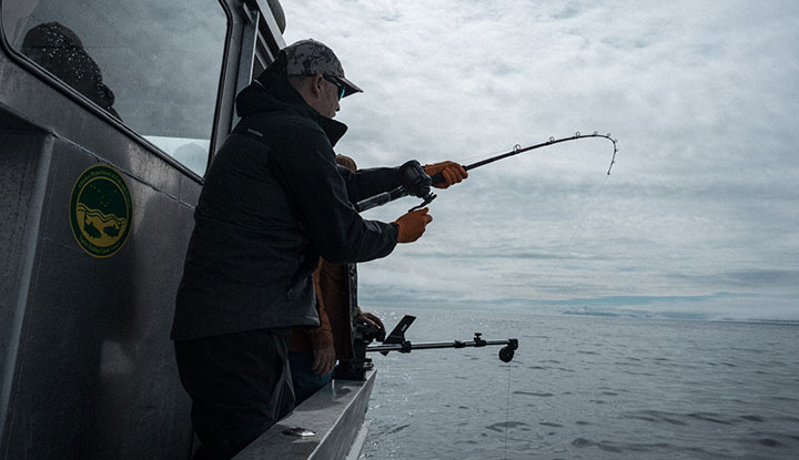 Catching a King Salmon on the ocean in Ugak Bay