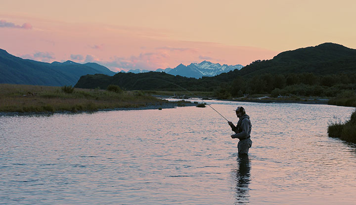 Fishing on the river at sunset